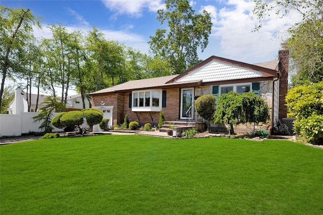 18 Hamilton St, Farmingdale, NY 11735 - view of front of property with an attached garage, a chimney, brick siding, and cooling unit