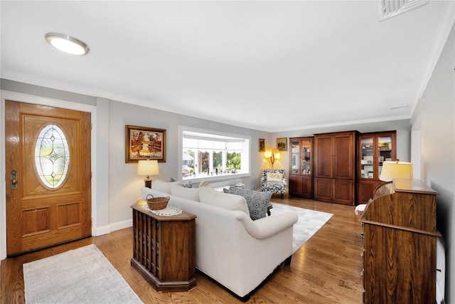 18 Hamilton St, Farmingdale, NY 11735 - living room with ornamental molding, light wood-type flooring, and baseboards