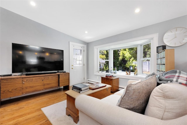 18 Hamilton St, Farmingdale, NY 11735 - living area with light wood finished floors, vaulted ceiling, recessed lighting, and a baseboard heating unit
