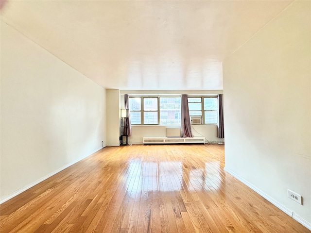 81-11 45th Ave Unit 3R, Elmhurst, NY 11373 - empty room with hardwood / wood-style flooring, baseboards, and baseboard heating