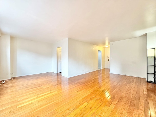 81-11 45th Ave Unit 3R, Elmhurst, NY 11373 - empty room with light wood finished floors and baseboards