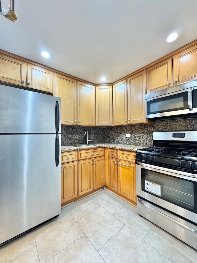 81-11 45th Ave Unit 3R, Elmhurst, NY 11373 - kitchen with appliances with stainless steel finishes, stone countertops, a sink, backsplash, and recessed lighting