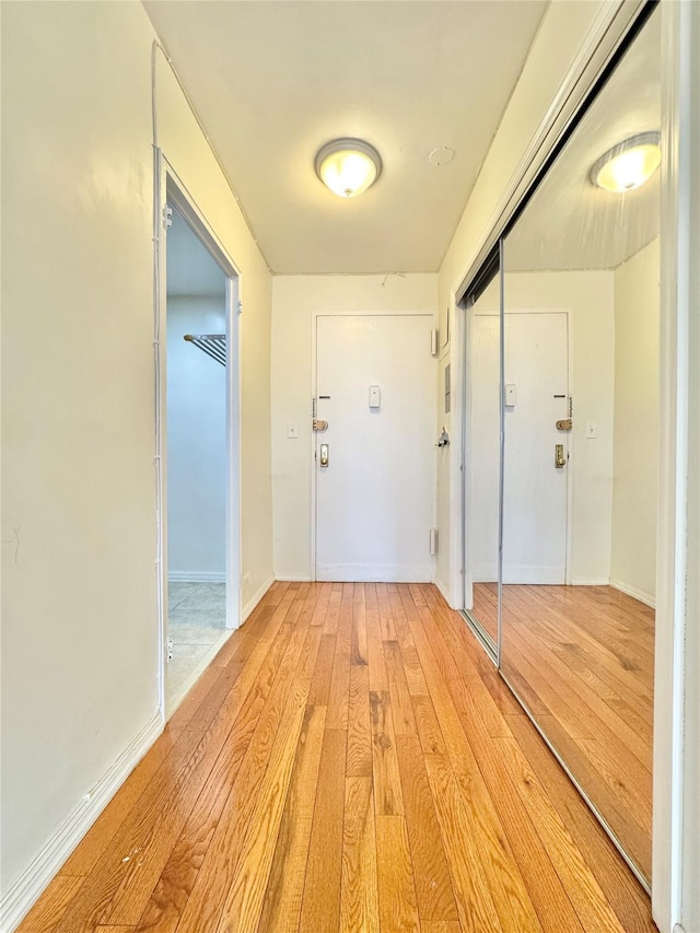 81-11 45th Ave Unit 3R, Elmhurst, NY 11373 - foyer with light wood-type flooring and baseboards