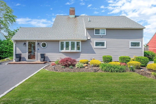 51 Pewter Ln, Hicksville, NY 11801 - view of front facade featuring a chimney, a front yard, and a shingled roof