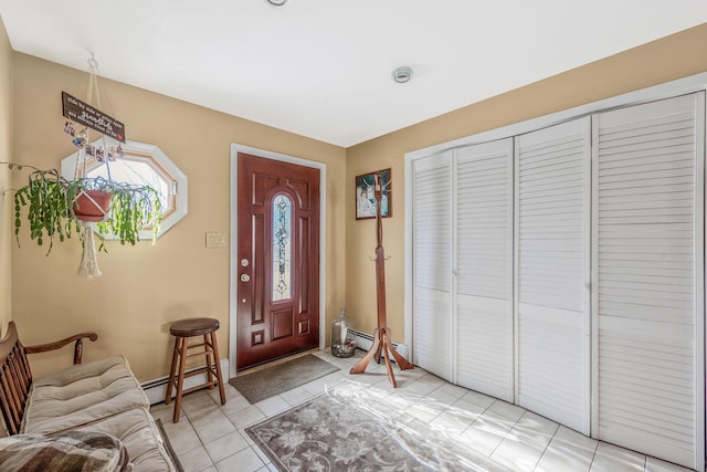 51 Pewter Ln, Hicksville, NY 11801 - foyer featuring baseboard heating, light tile patterned floors, and a baseboard heating unit