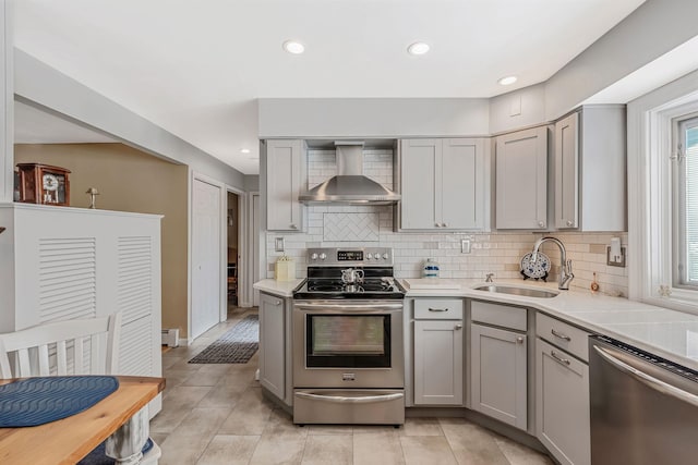 51 Pewter Ln, Hicksville, NY 11801 - kitchen featuring stainless steel appliances, gray cabinetry, wall chimney exhaust hood, a sink, and light countertops