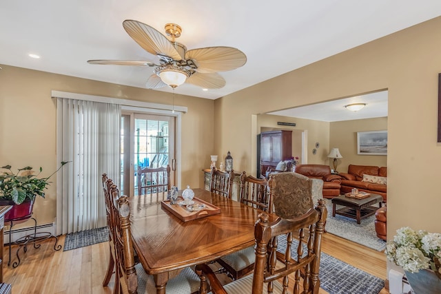 51 Pewter Ln, Hicksville, NY 11801 - dining room featuring ceiling fan, light wood finished floors, a baseboard radiator, and recessed lighting