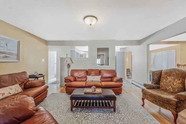 51 Pewter Ln, Hicksville, NY 11801 - living area featuring a baseboard radiator and light wood finished floors