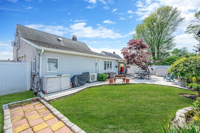51 Pewter Ln, Hicksville, NY 11801 - back of property with a patio area, ac unit, and a chimney