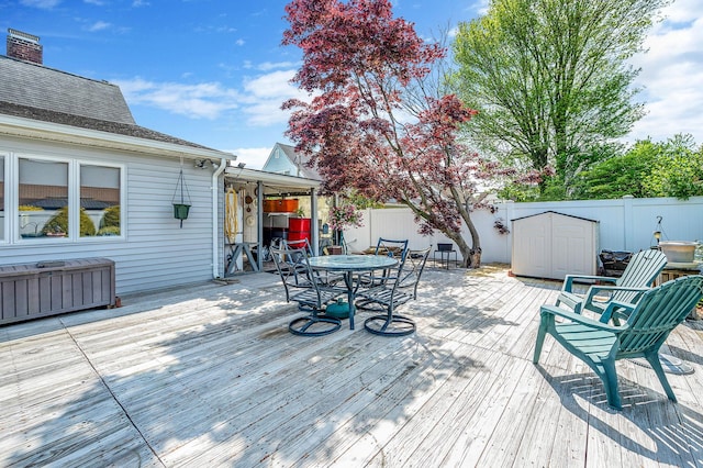 51 Pewter Ln, Hicksville, NY 11801 - wooden terrace with a fenced backyard and outdoor dining area