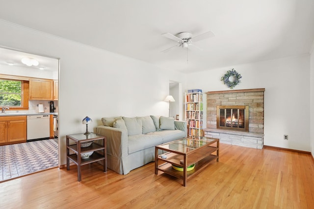 7 Adele Ct, Montrose, NY 10567 - living room with a ceiling fan, light wood finished floors, and a fireplace