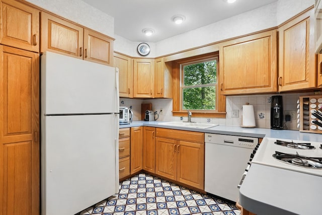 7 Adele Ct, Montrose, NY 10567 - kitchen with white appliances, a sink, light countertops, and decorative backsplash