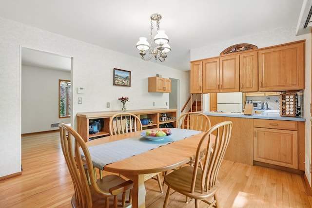 7 Adele Ct, Montrose, NY 10567 - dining area featuring light wood-style flooring, a chandelier, and baseboards