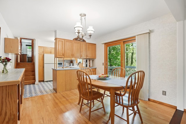 7 Adele Ct, Montrose, NY 10567 - dining room with light wood finished floors and a chandelier