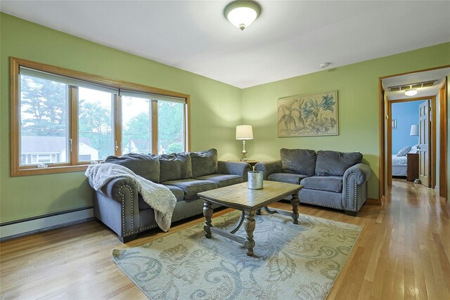 29 Jackson Dr, Stony Point, NY 10980 - living area with light wood-style flooring and a baseboard heating unit