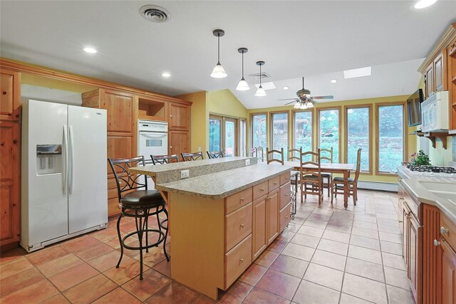29 Jackson Dr, Stony Point, NY 10980 - kitchen featuring white appliances, a kitchen breakfast bar, light countertops, ceiling fan, and recessed lighting