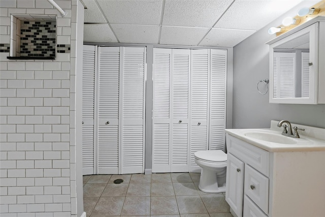 29 Jackson Dr, Stony Point, NY 10980 - full bath featuring a closet, toilet, vanity, tile patterned floors, and a paneled ceiling