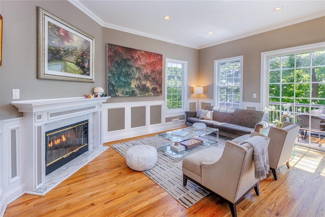 2740 Netherland Ave, Bronx, NY 10463 - living room featuring wood finished floors, ornamental molding, recessed lighting, a high end fireplace, and wainscoting