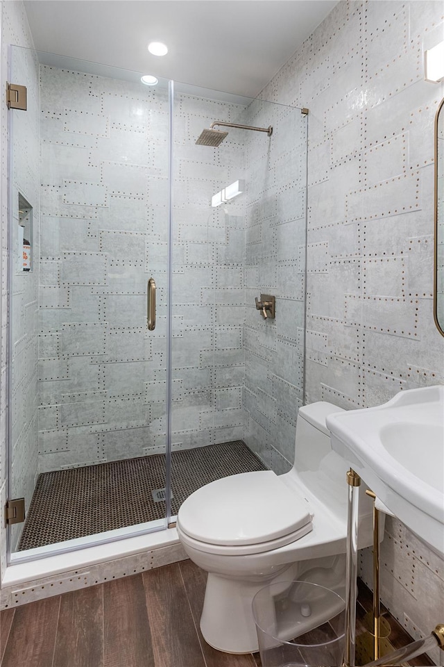 2740 Netherland Ave, Bronx, NY 10463 - full bathroom featuring wood finished floors, toilet, and a shower stall