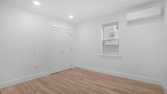 3964 Duryea Ave, Bronx, NY 10466 - unfurnished bedroom featuring a wall mounted AC, wood tiled floors, baseboards, and recessed lighting