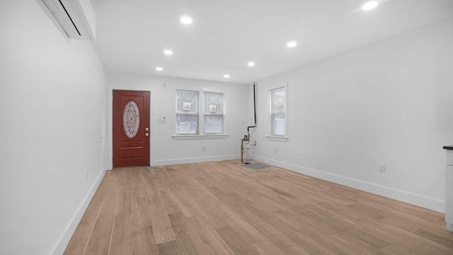 3964 Duryea Ave, Bronx, NY 10466 - entryway featuring an AC wall unit, recessed lighting, light wood-type flooring, and baseboards