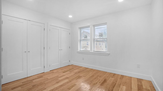 3964 Duryea Ave, Bronx, NY 10466 - unfurnished bedroom with multiple closets, light wood-type flooring, baseboards, and recessed lighting