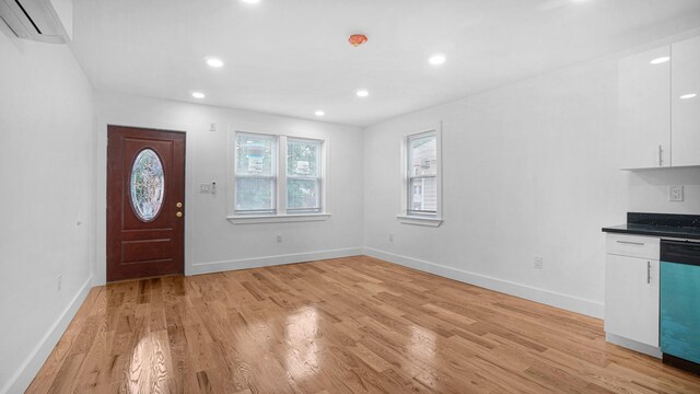 3964 Duryea Ave, Bronx, NY 10466 - foyer with an AC wall unit, light wood finished floors, baseboards, and recessed lighting