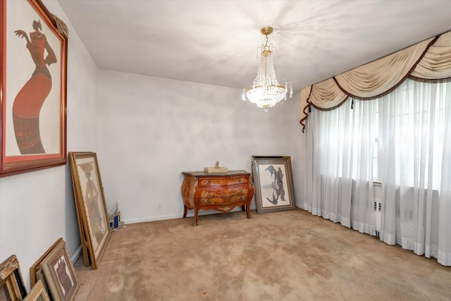725 Clinton St, Westbury, NY 11590 - unfurnished room featuring carpet floors, a chandelier, and baseboards