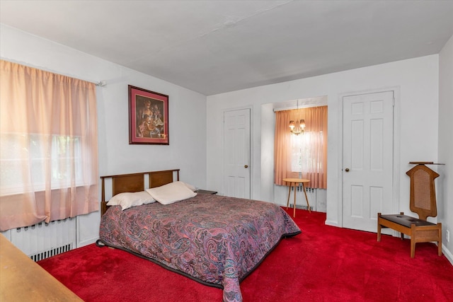 725 Clinton St, Westbury, NY 11590 - bedroom with radiator heating unit, carpet, multiple windows, and baseboards