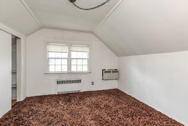 725 Clinton St, Westbury, NY 11590 - bonus room with radiator heating unit, lofted ceiling, a wall mounted AC, carpet, and baseboards