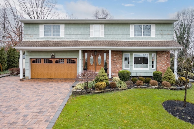 14 Merritts Rd, Farmingdale, NY 11735 - view of front facade featuring a garage, roof with shingles, a front yard, and decorative driveway