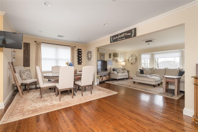 14 Merritts Rd, Farmingdale, NY 11735 - dining room featuring wood finished floors and ornamental molding