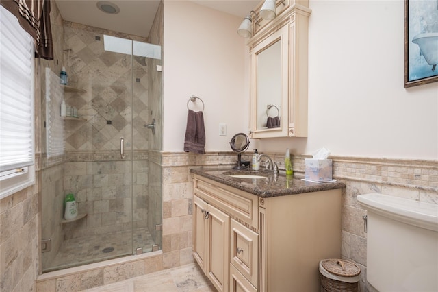14 Merritts Rd, Farmingdale, NY 11735 - full bathroom featuring vanity, a shower stall, tile walls, a wainscoted wall, and toilet