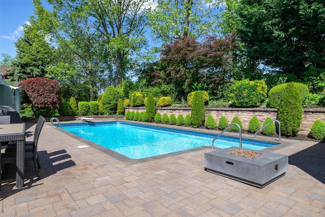 14 Merritts Rd, Farmingdale, NY 11735 - outdoor pool with a patio area and an outdoor fire pit