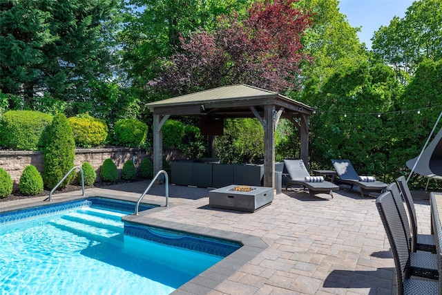 14 Merritts Rd, Farmingdale, NY 11735 - view of pool featuring a gazebo, a patio area, an outdoor living space with a fire pit, and a fenced backyard