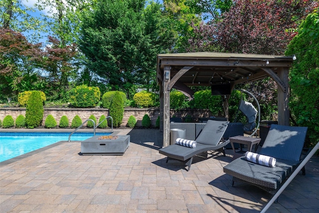 14 Merritts Rd, Farmingdale, NY 11735 - view of patio / terrace with a gazebo, an outdoor fire pit, and an outdoor pool