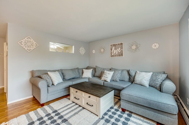 2453 Union Blvd Unit 37A, Islip, NY 11751 - living room with a baseboard heating unit, light wood-style flooring, and baseboards