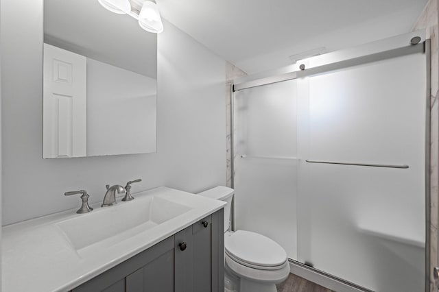 2453 Union Blvd Unit 37A, Islip, NY 11751 - full bath featuring toilet, vanity, a shower stall, and wood finished floors