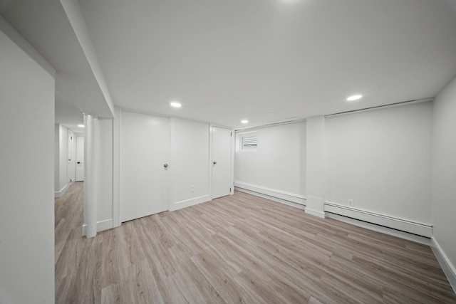 14-09 131st St, College Point, NY 11356 - finished basement featuring a baseboard radiator, wood finished floors, recessed lighting, and baseboards