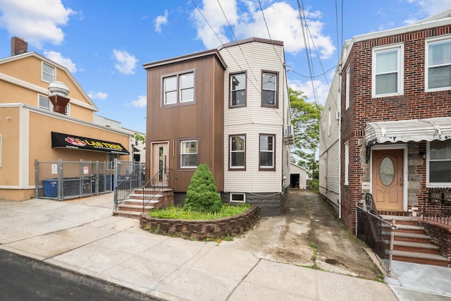 14-09 131st St, College Point, NY 11356 - townhome / multi-family property with a gate and fence