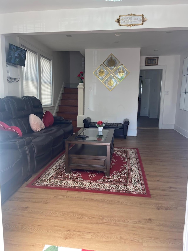 17363 105th Ave, Jamaica, NY 11433 - living room featuring wood finished floors, stairs, and baseboards