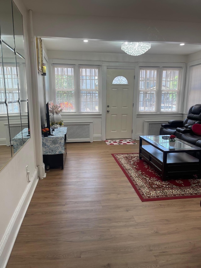 17363 105th Ave, Jamaica, NY 11433 - entryway with radiator heating unit, wood finished floors, baseboards, and recessed lighting