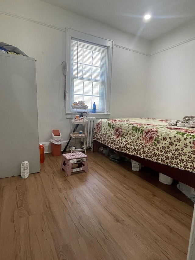 17363 105th Ave, Jamaica, NY 11433 - bedroom with wood finished floors and radiator