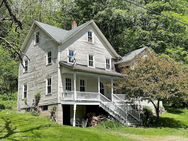 12 Henderson Rd, Hankins, NY 12741 - view of front of property with a porch, stairs, a front yard, and a chimney