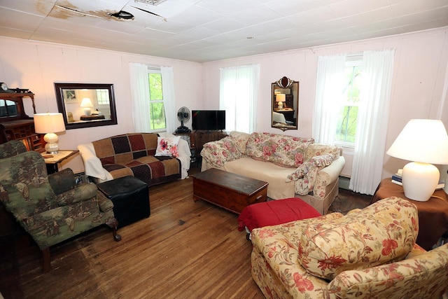 12 Henderson Rd, Hankins, NY 12741 - living area featuring wood finished floors, a baseboard heating unit, and a decorative wall
