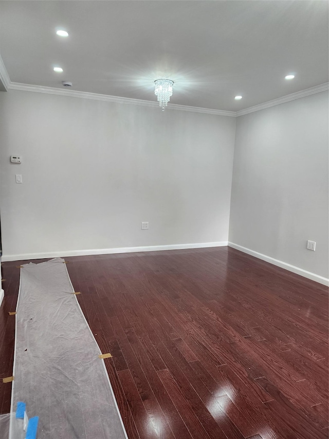 224-06 114th Rd, Cambria Heights, NY 11411 - spare room featuring dark wood finished floors, baseboards, ornamental molding, and recessed lighting