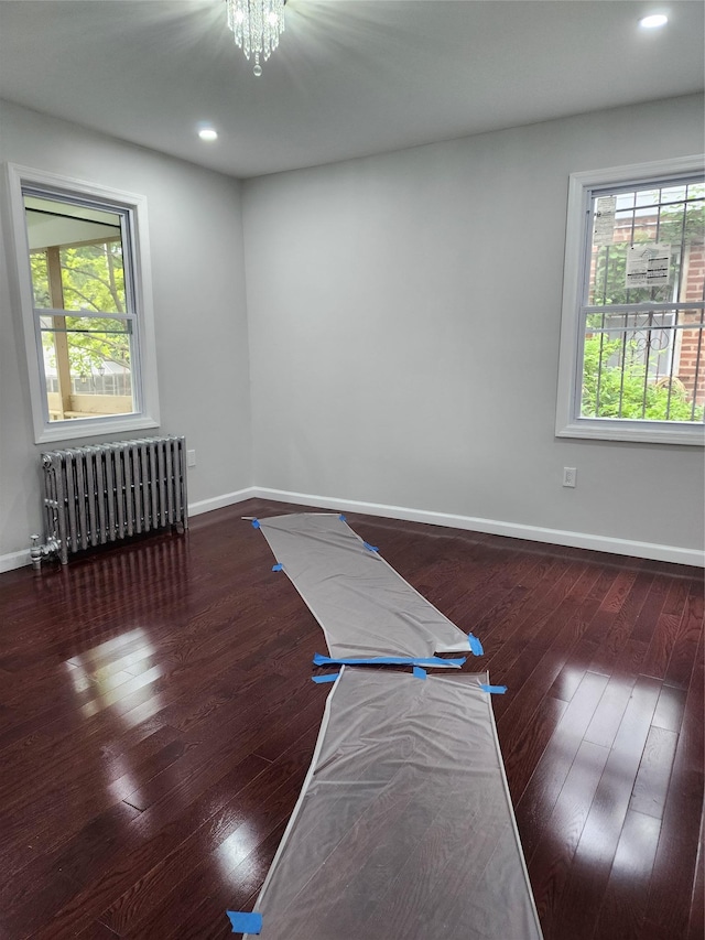 224-06 114th Rd, Cambria Heights, NY 11411 - unfurnished room featuring radiator heating unit, plenty of natural light, baseboards, hardwood / wood-style floors, and recessed lighting