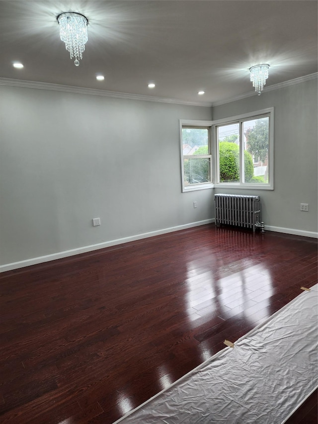 224-06 114th Rd, Cambria Heights, NY 11411 - empty room featuring radiator heating unit, a chandelier, ornamental molding, wood finished floors, and baseboards