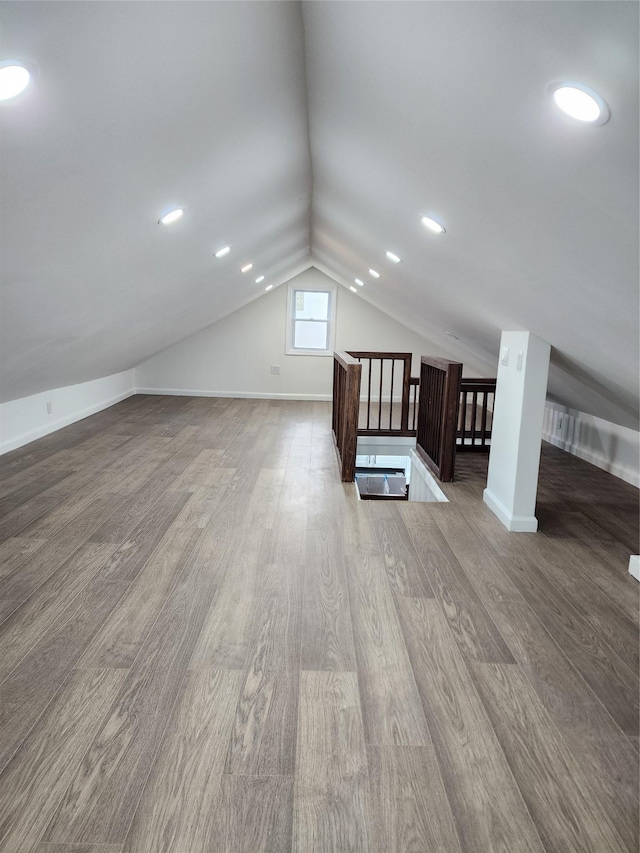 224-06 114th Rd, Cambria Heights, NY 11411 - additional living space with wood finished floors, vaulted ceiling, and baseboards