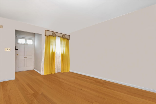 7345 53rd Rd, Maspeth, NY 11378 - empty room with light wood-style flooring and baseboards